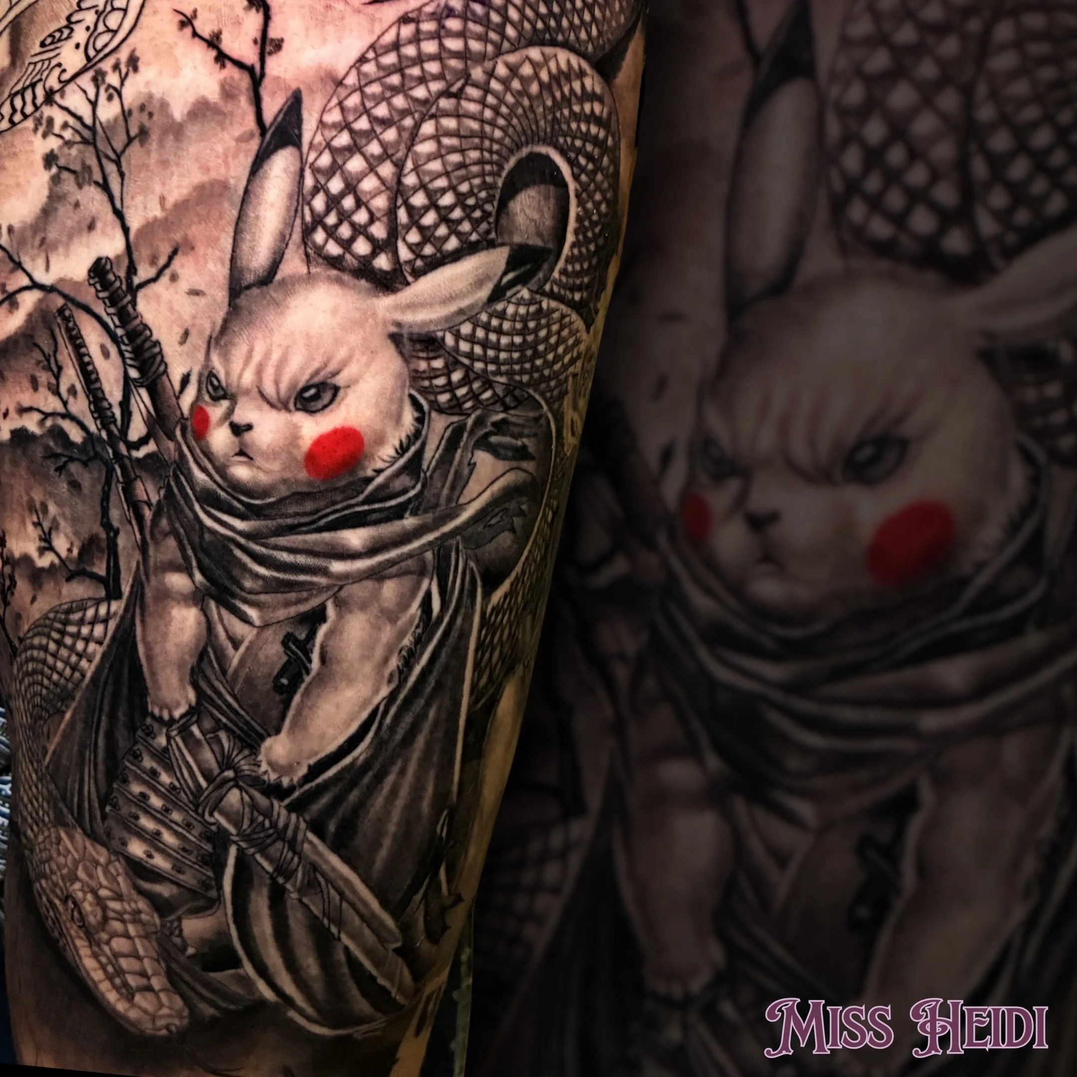 The level of detail Miss Heidi worked into this samurai Pikachu is insane. Leaving the signature red cheeks as the only pop of color against that heavy, atmospheric black and grey wash makes the whole design visually jump off the skin. It&rsquo;s the