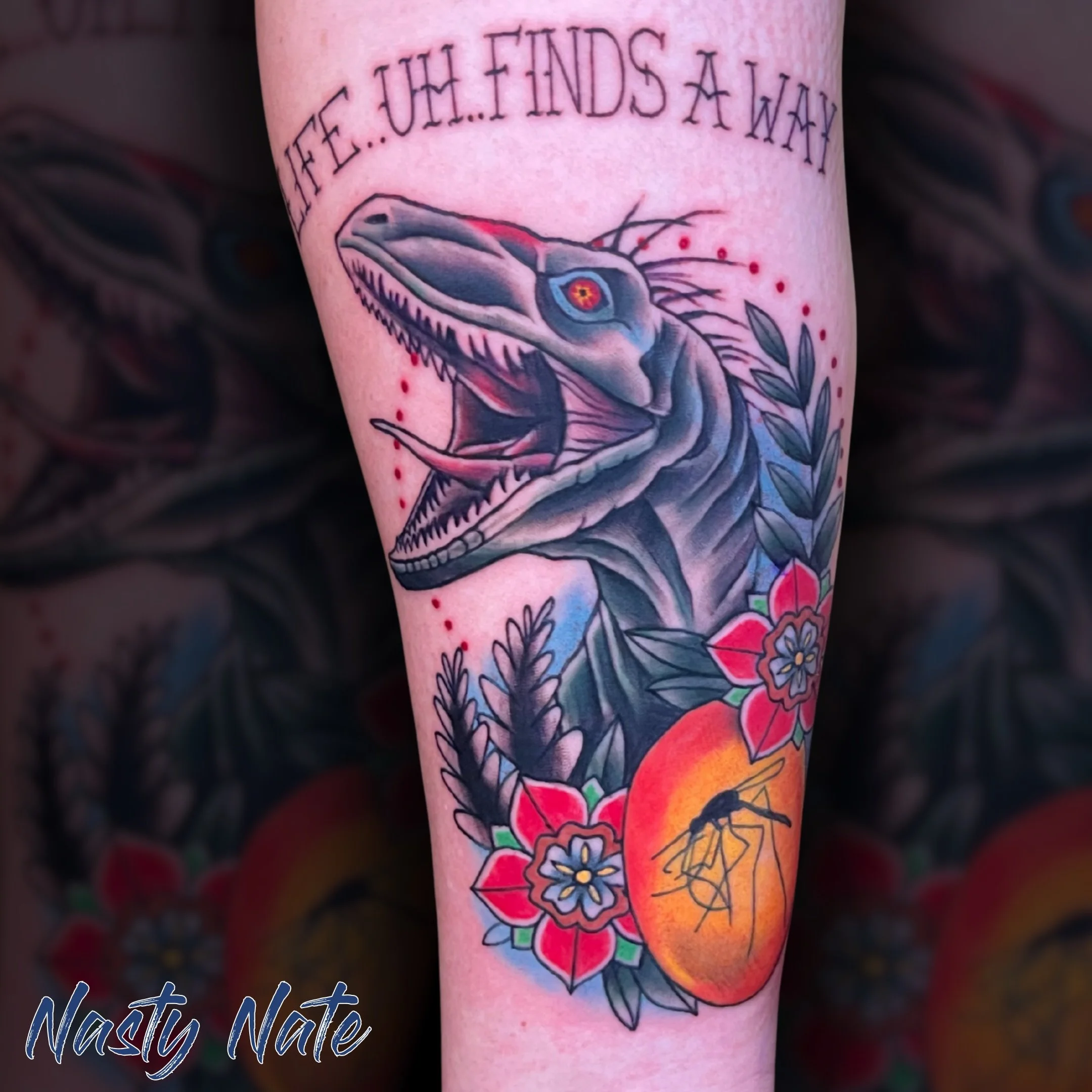 Life... uh... finds a way. 🦖 @tattoos_by_nastynate really brought the park back to life with this  raptor piece!
He crushed this bold style, combining saturated colors with crisp linework. Definitely a standout piece. Is anyone else feeling nostalgi