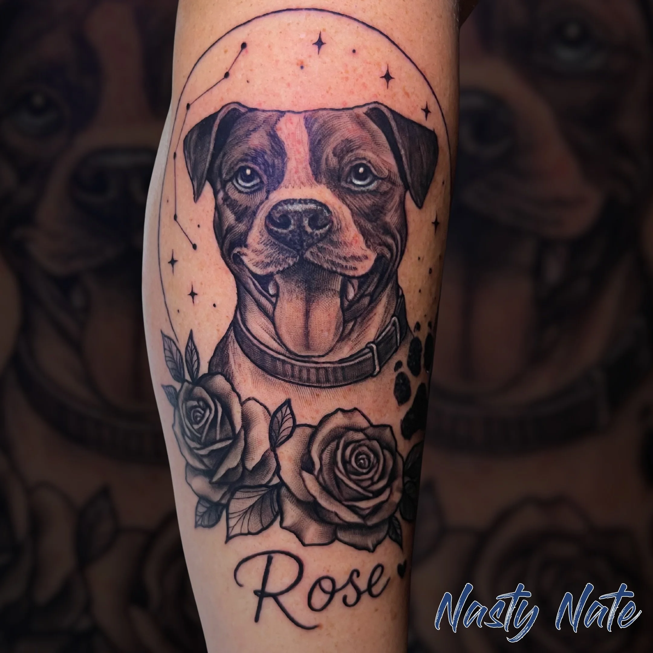 Forever the goodest girl. 🐶 @tattoos_by_nastynate put so much heart into this pet memorial piece for Rose. The detail in her sweet expression, paired with the delicate star constellation halo and those soft roses below, turned out so special. Honor 