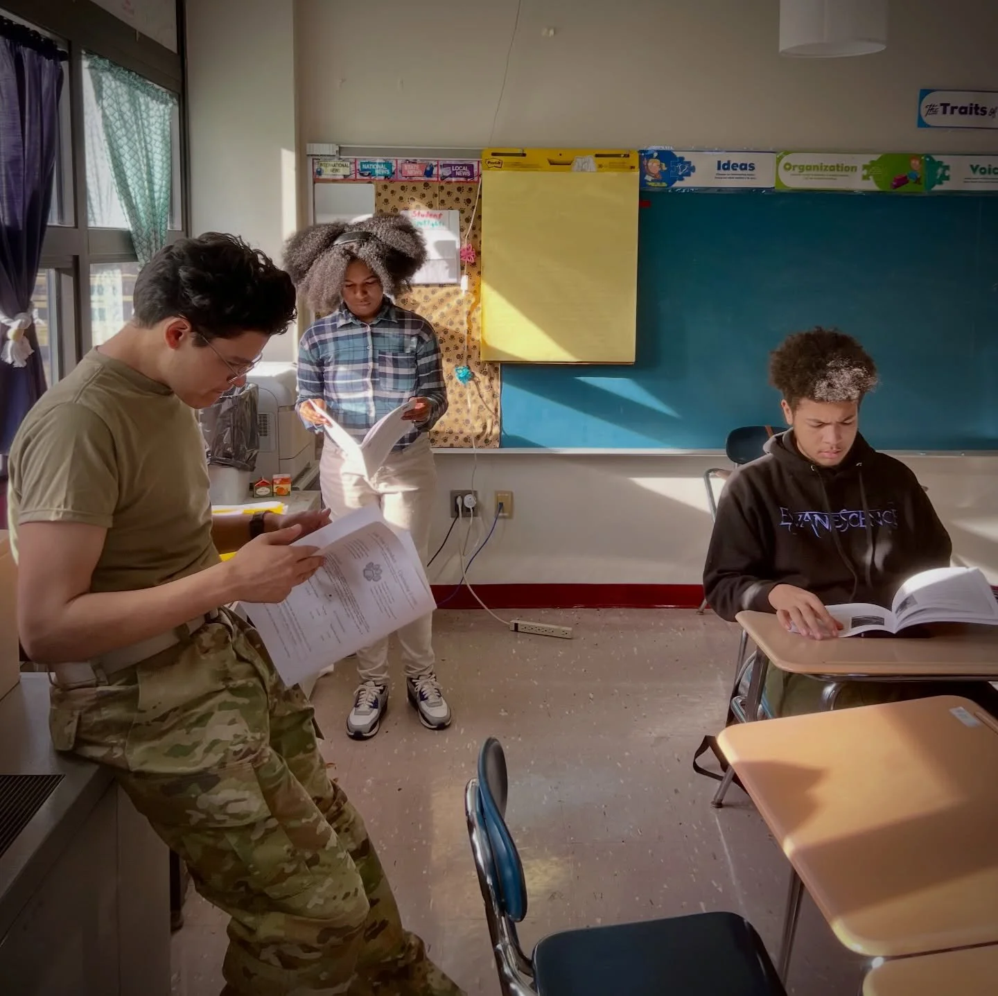 Jonovan, Karma and Tristan read the latest edition of the Red and Blue student newspaper during a @mck__newspaper meeting before it&rsquo;s distributed to students at McKeesport Area High School. 

#studentjournalism #mckeesport