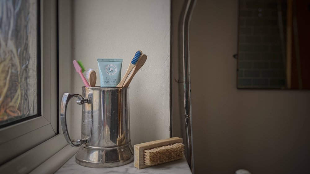 My husband's tankard now a family toothbrush holder 