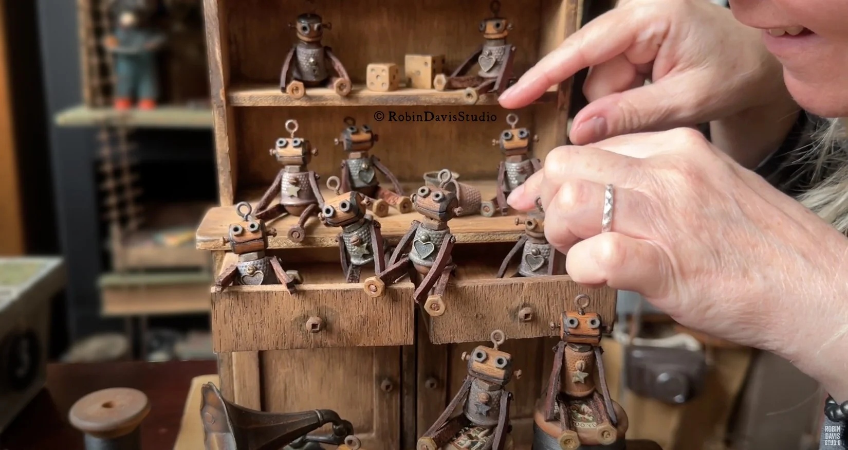 Tiny wooden handcrafted robots made with vintage treasures by Robin Davis Studio.