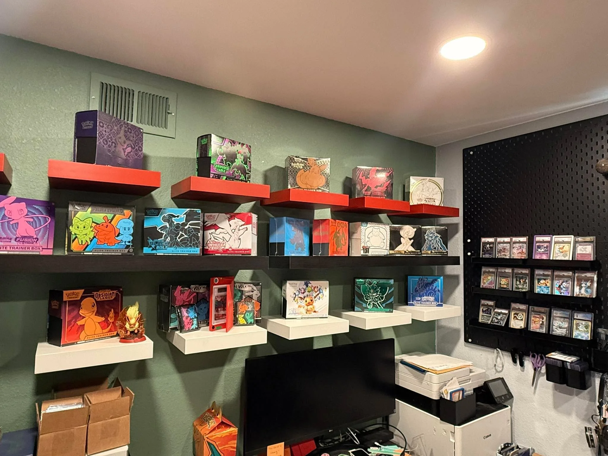 Home nerd project for Rebecca McGuigan completed. Did floating shelves with pokeball color palette and added a couple pegboards as well.