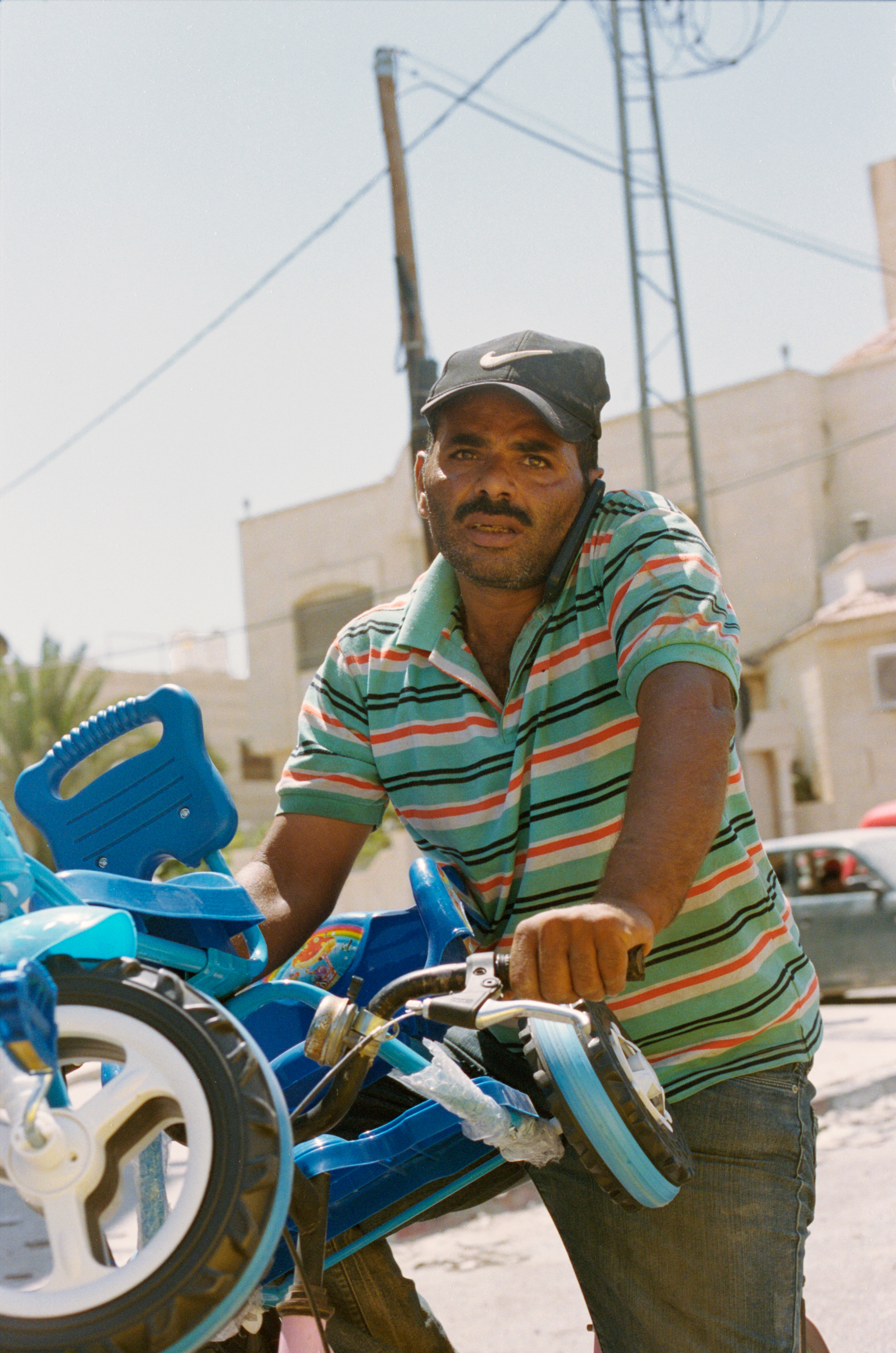 Man with Two Bikes, Jericho, 2018