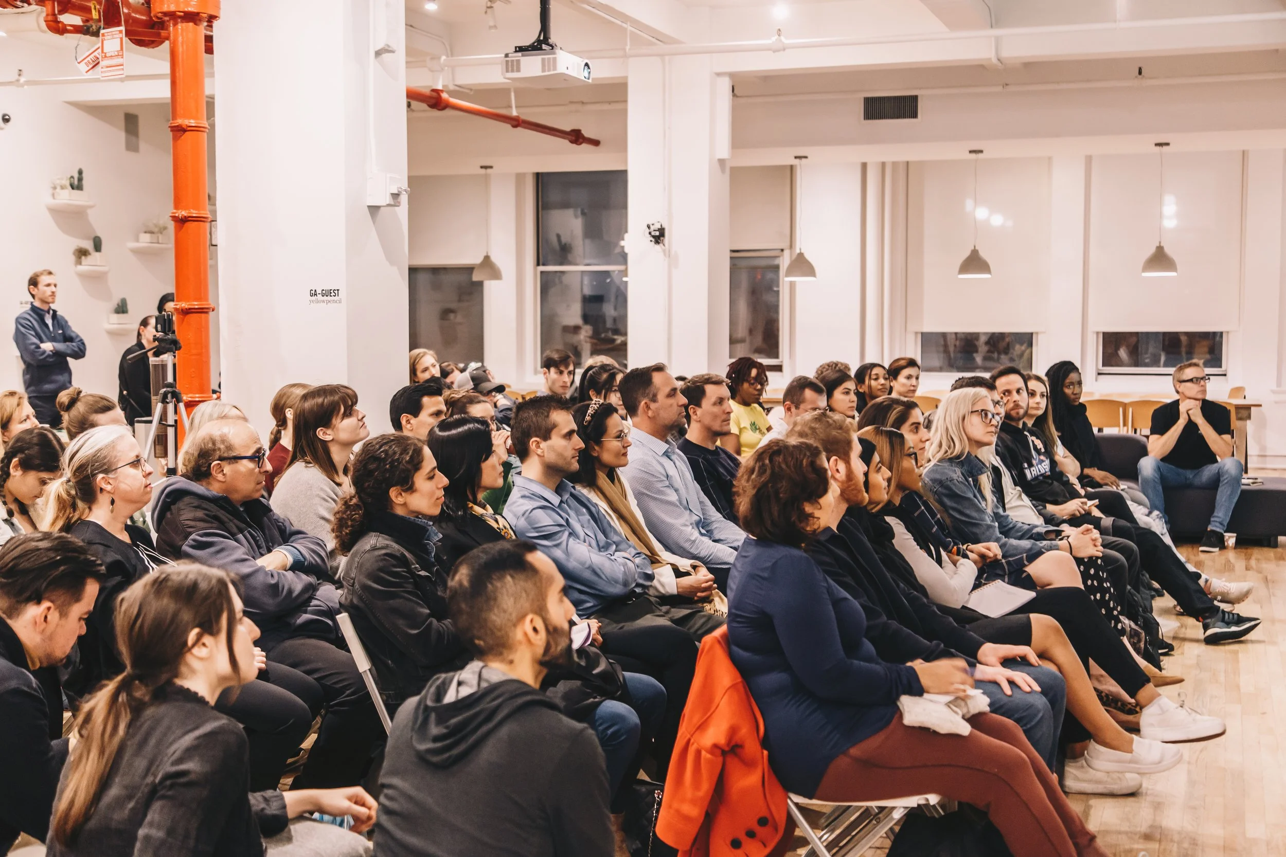 engaged-audience-seated-in-loft-space.jpeg