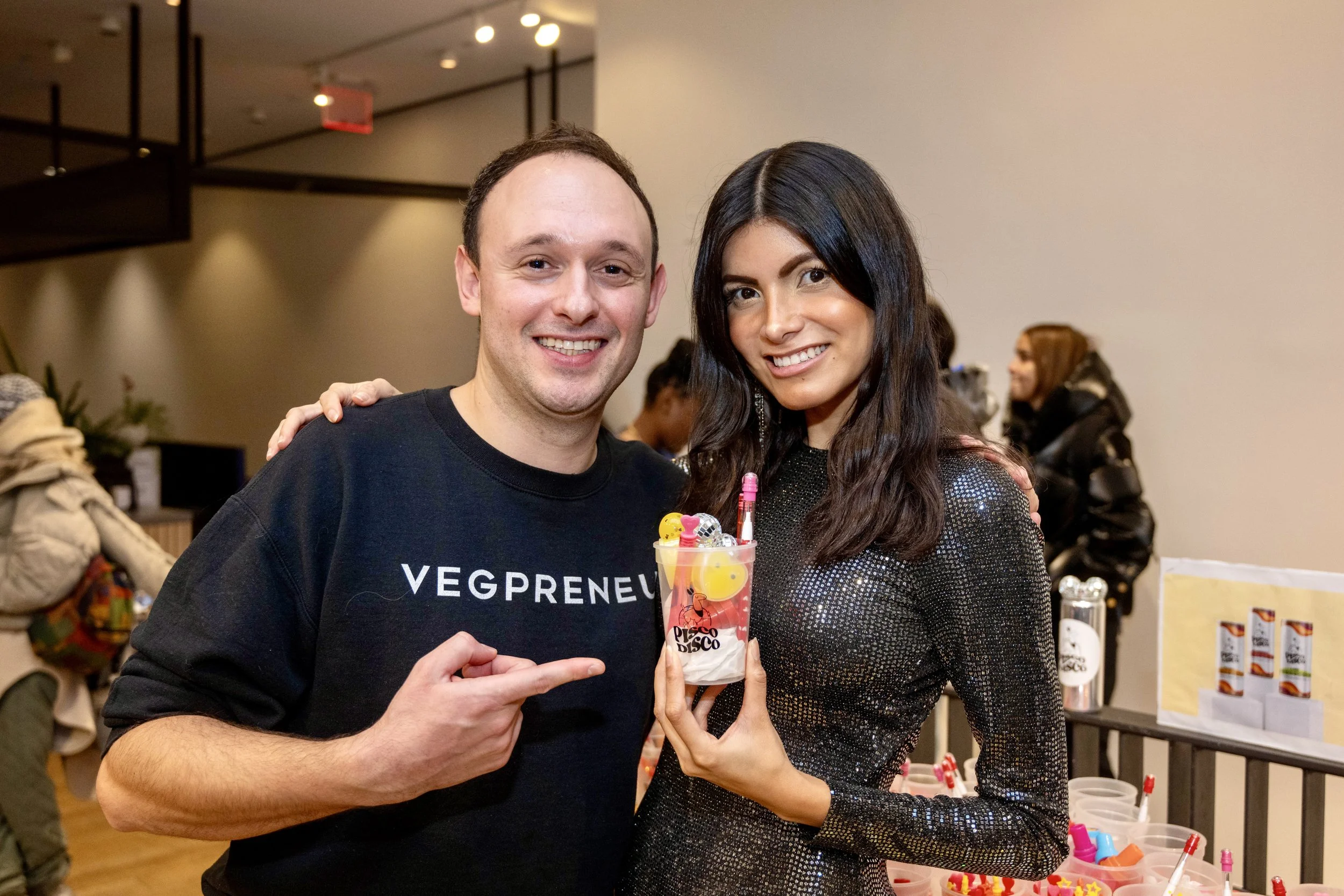 man-in-vegpreneur-shirt-with-woman-holding-cocktail.jpeg