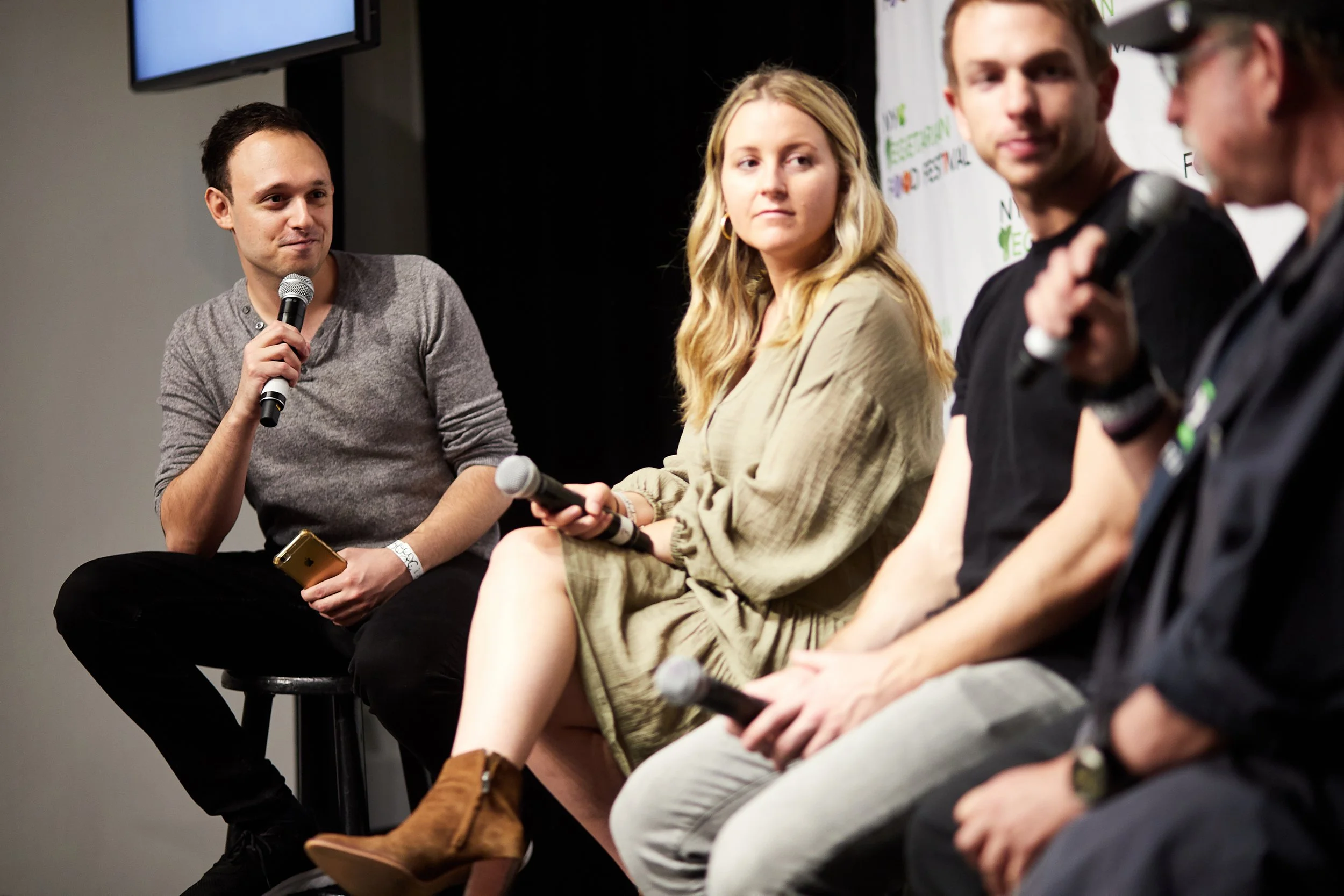 panel-discussion-four-speakers-seated.jpeg