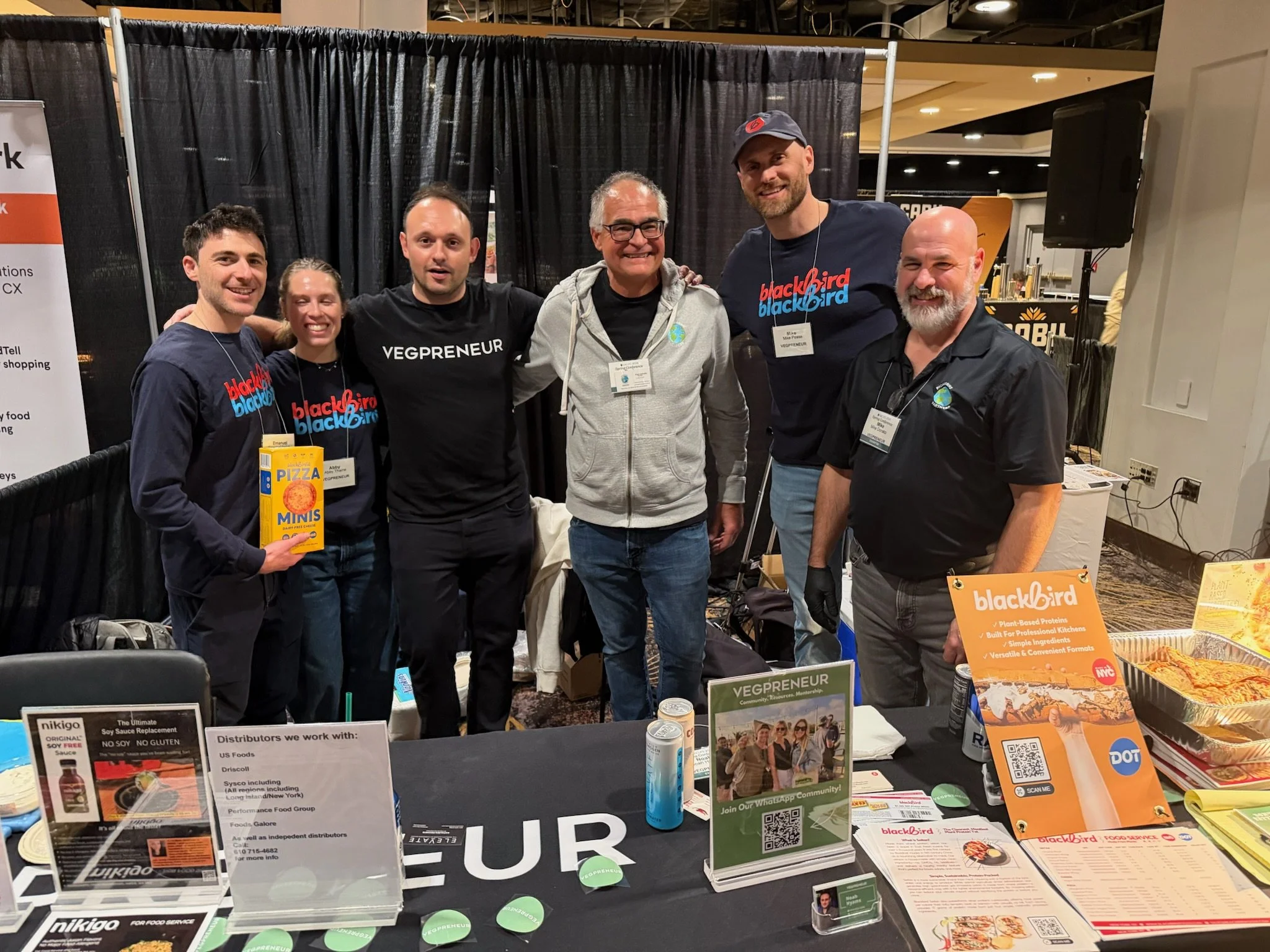 team-group-photo-at-vegpreneur-trade-show-booth.JPG