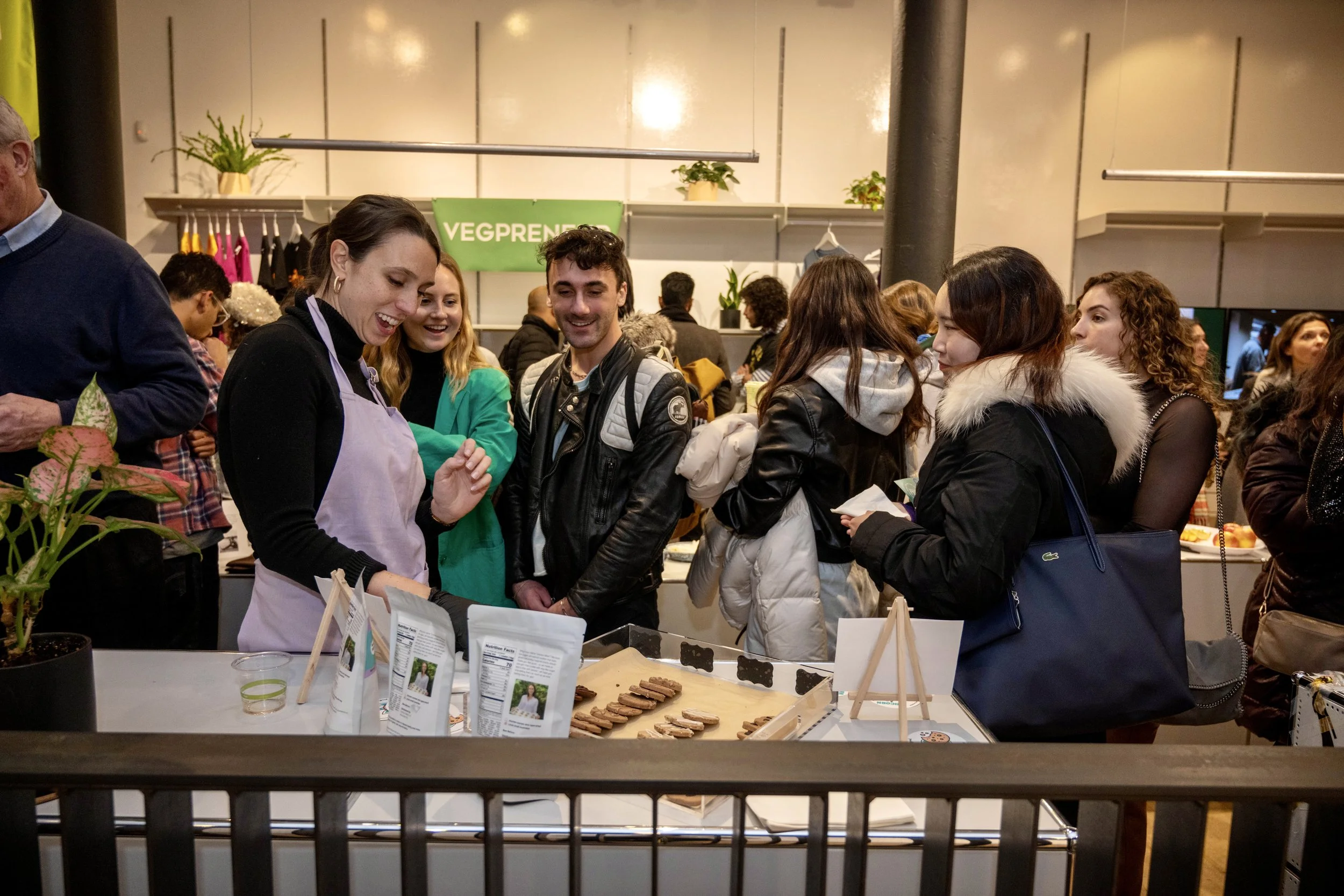 vendors-and-attendees-at-product-table.jpeg