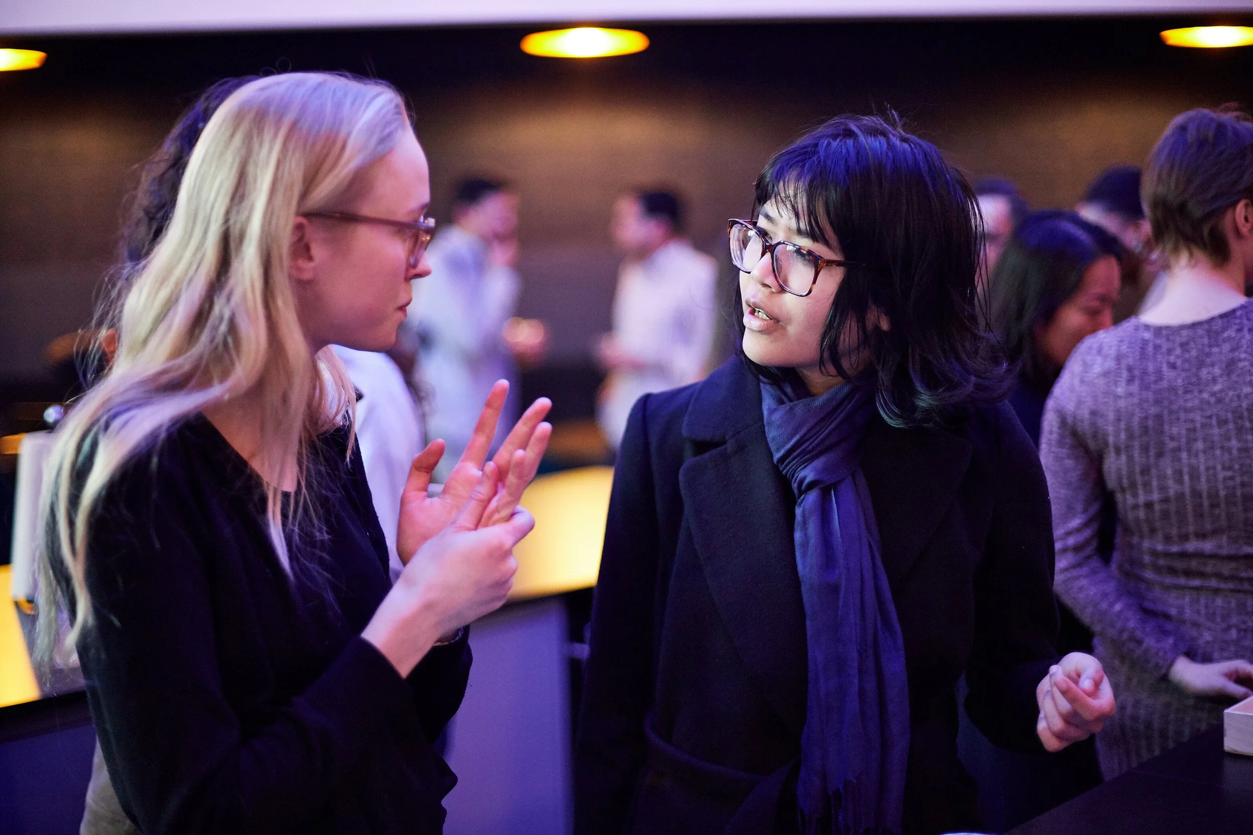 two-women-in-conversation-at-networking-event.jpeg