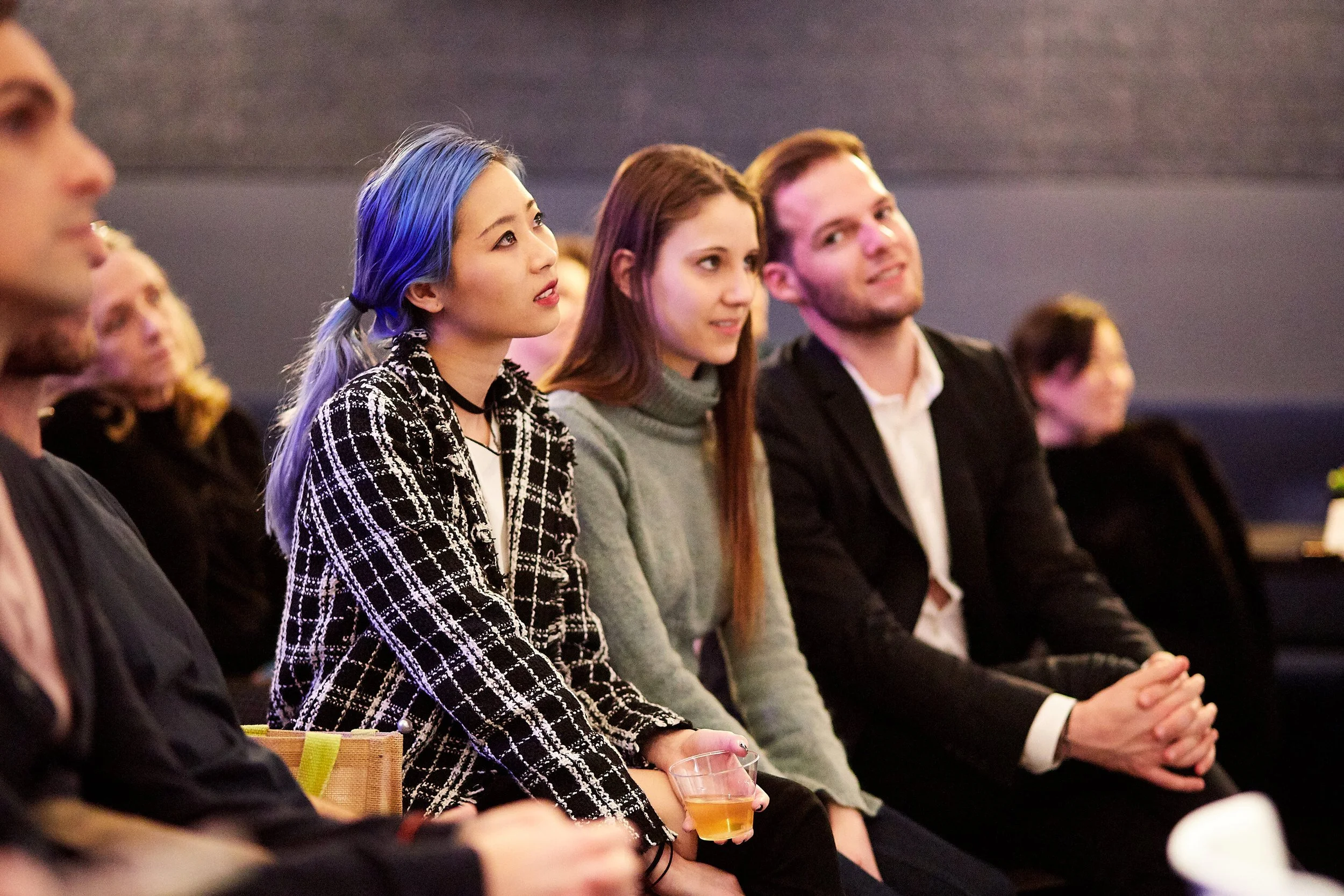 young-attendees-watching-presentation-closeup.jpeg