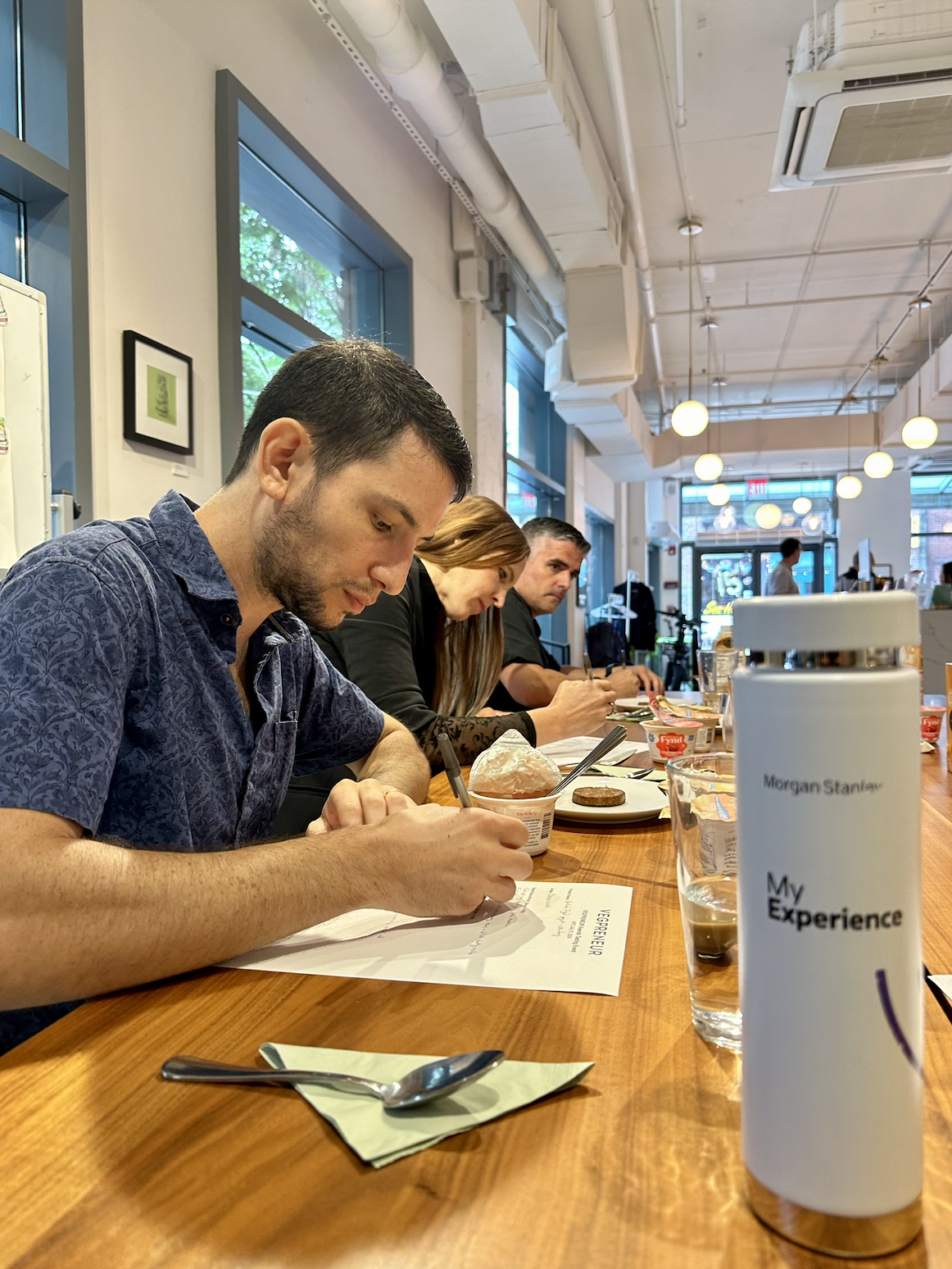 Judges tasting and scoring products at a private evaluation event