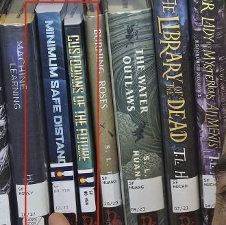 Xwithbooksinlibrary.png