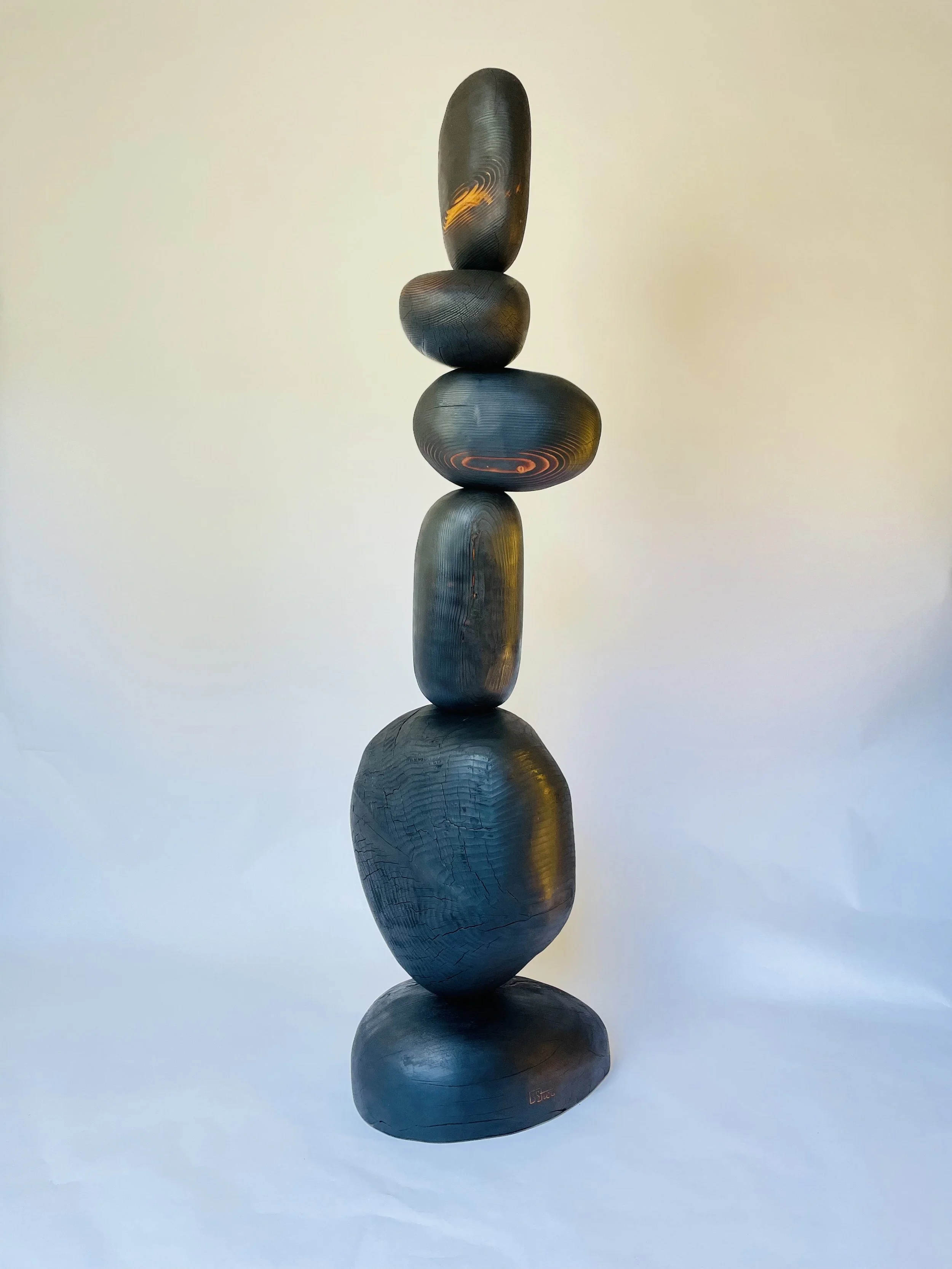 Carved wood, yakisugi finish. Steel base. 6’-6” H