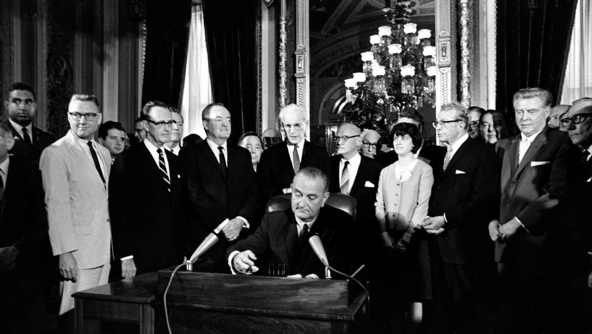 President Lyndon B. Johnson signing the Voting Rights Act into affect on August 6, 1965. via Politico