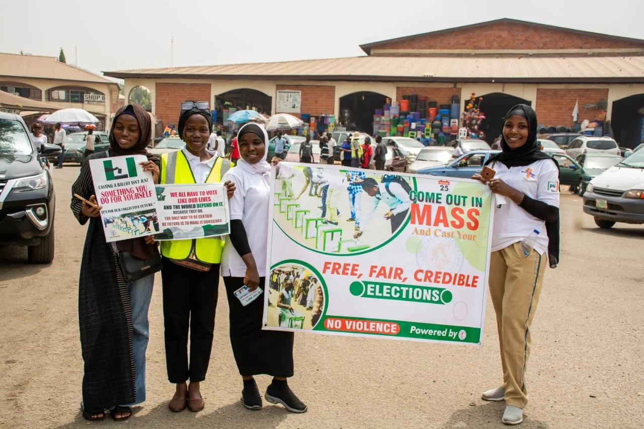 Christian and Muslim Corpers Embark on Pre-Election Market Sensitization Campaigns