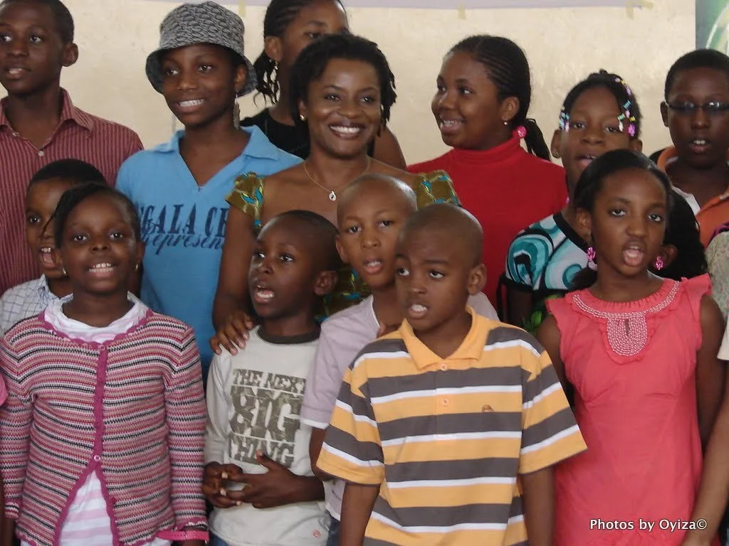 Oyiza with school children.jpg
