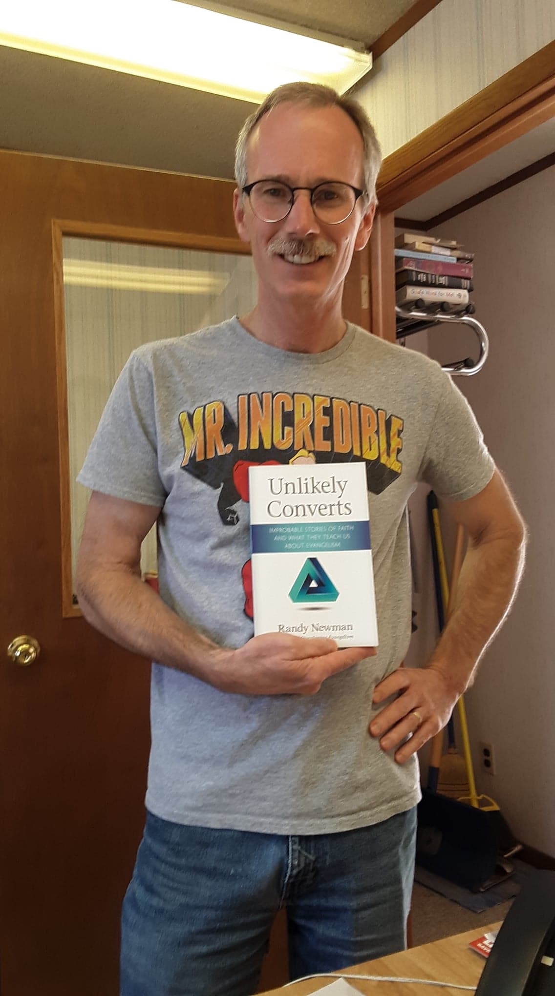  Russ shows off Unlikely Converts, authored by today’s Coffee Break guest Randy Newman. 