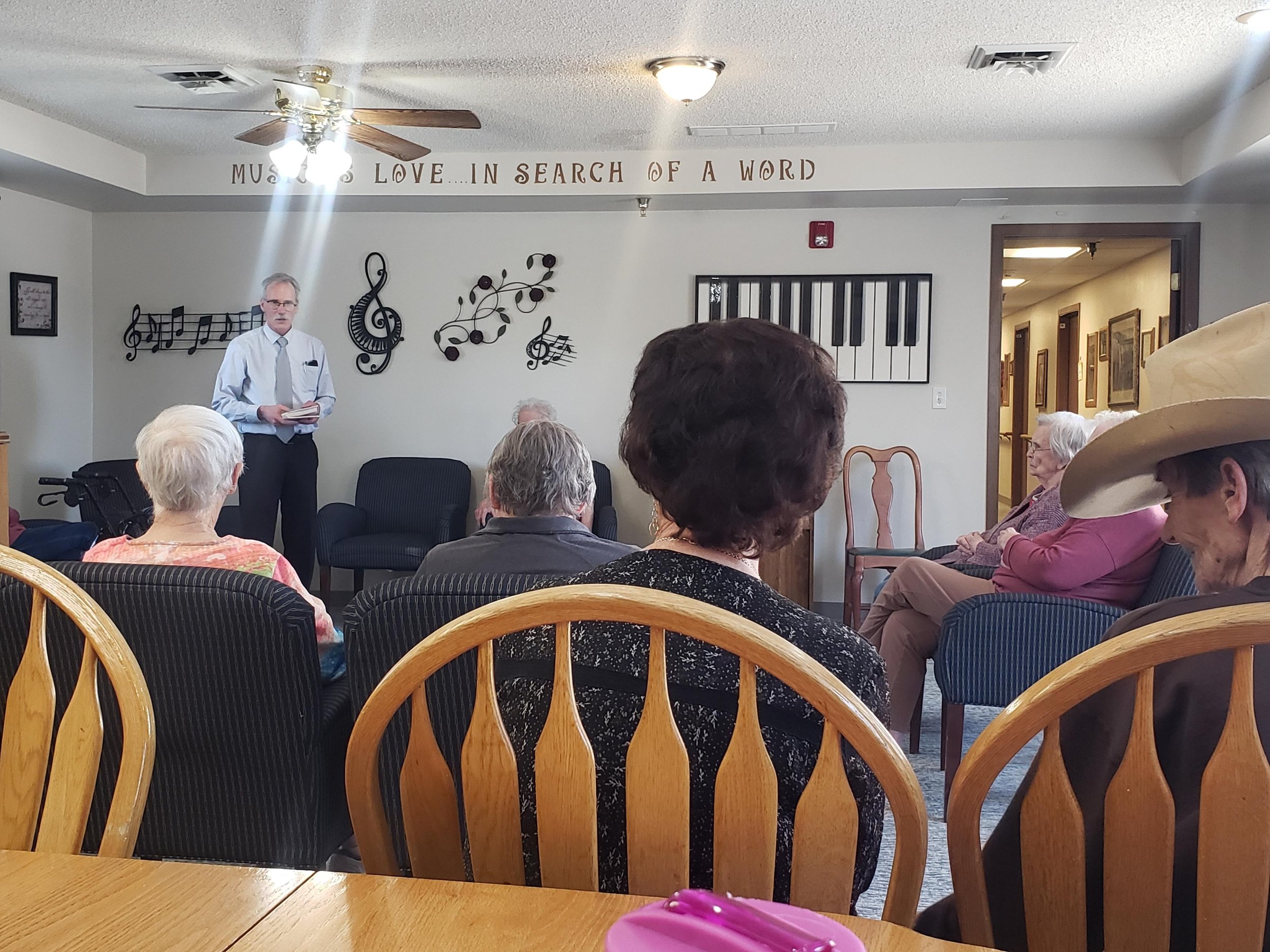 Russ Garrett leading residents in singing hymns