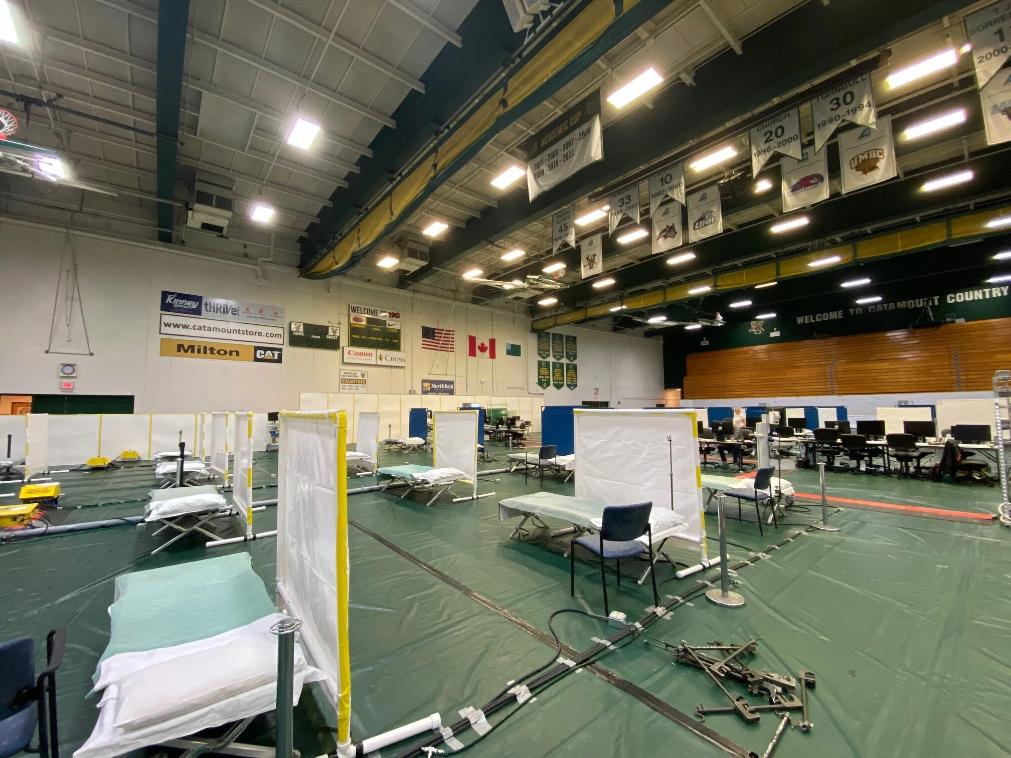 Guard troops transform UVM basketball gym for hospital patient overflow