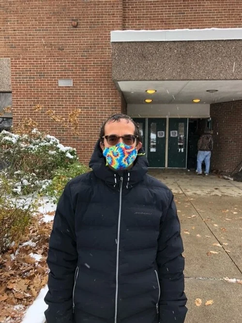 Portilla contemplates his vote outside Camel’s Hump Middle School. (Ellery Mahlum/Community News Service)