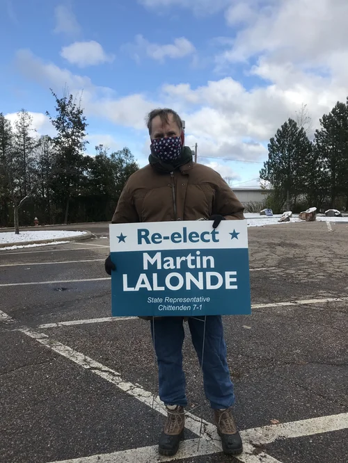 Martin Lalonde, State Representative for District 7-1, outside of Orchard School in South Burlington, campaigning in the cold unopposed. (Adrianna Maher/Community News Service)