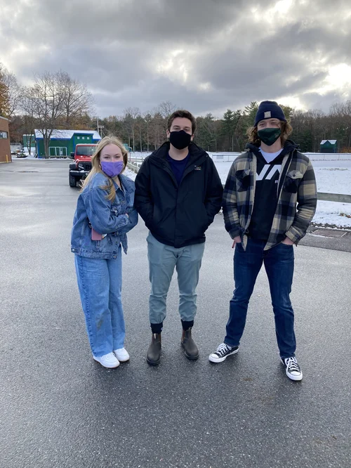 From left to right, Nora Tetrick, Sam Burgess, and Max Anderson all brave the cold to answer a few questions about casting their first ballots. (Aidan Scanlon/Community News Service)