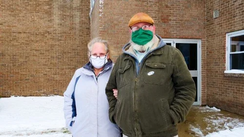 Linda and Damian Boivin stand outside of the Georgia School after voting in person Tuesday morning, as they say they do every election. (Brooke McKeen/Community News Service)