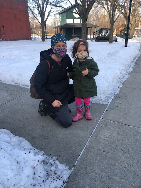 Social worker Charlotte McCorkel, 36, alongside her daughter Demi McCorkel outside the Shelburne Town Gym on Town Meeting Day. (Megan Slevin/Community News Service)