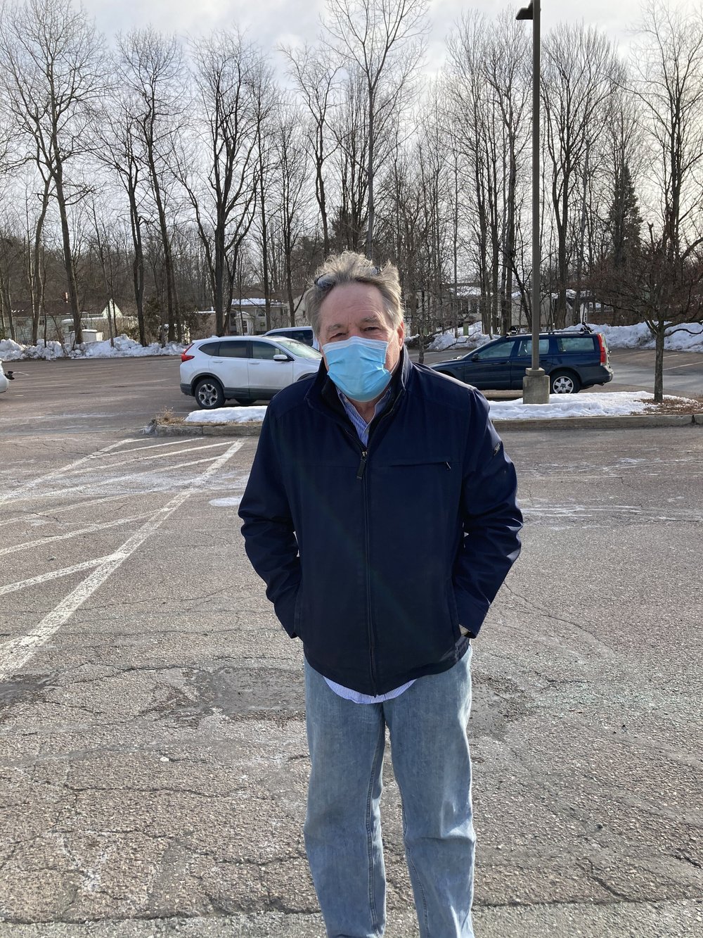 Michael Powers poses for a photo before hurrying back to the warmth of his car in South Burlington. (Aidan Scanlon/Community News Service)