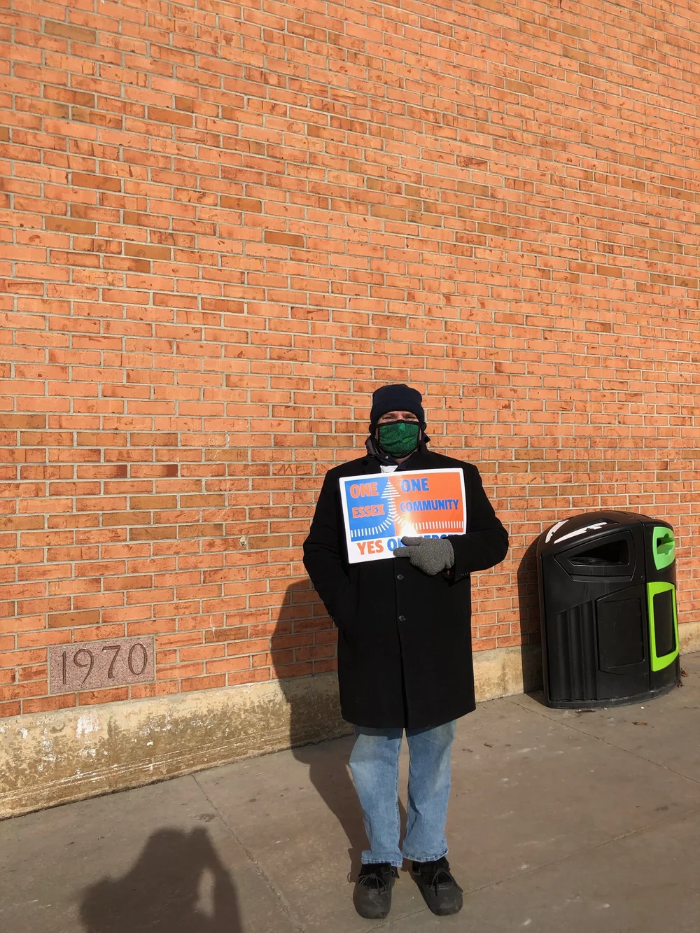 Scott Moore campaigns for the Essex merger outside of Essex High School, Tuesday March 2. (Jen Lannom/Community News Service)