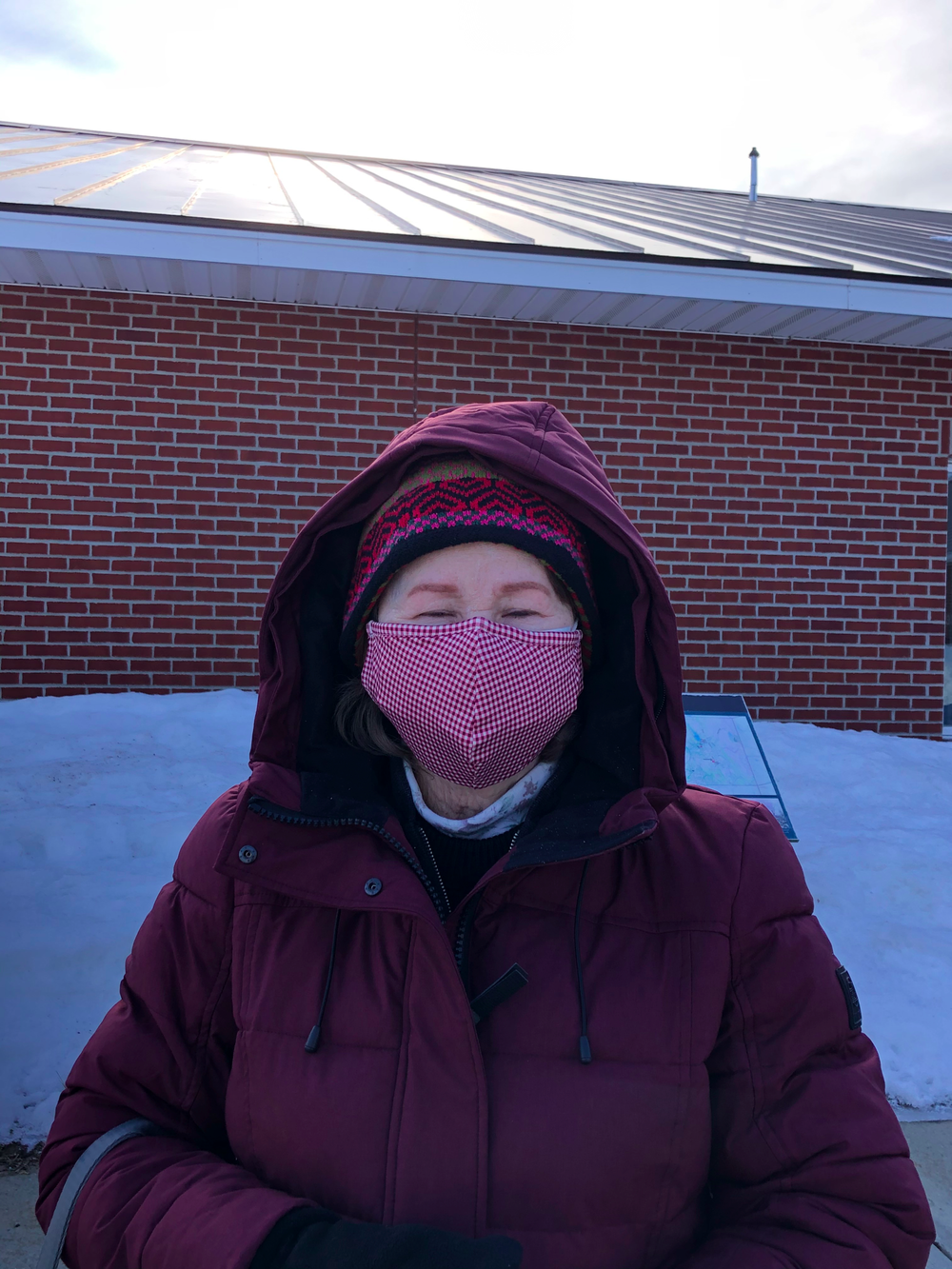Karen Kruger, 70, heads into the Milton town clerk's office to cast her vote. (Erin O’Connor/Community News Service)