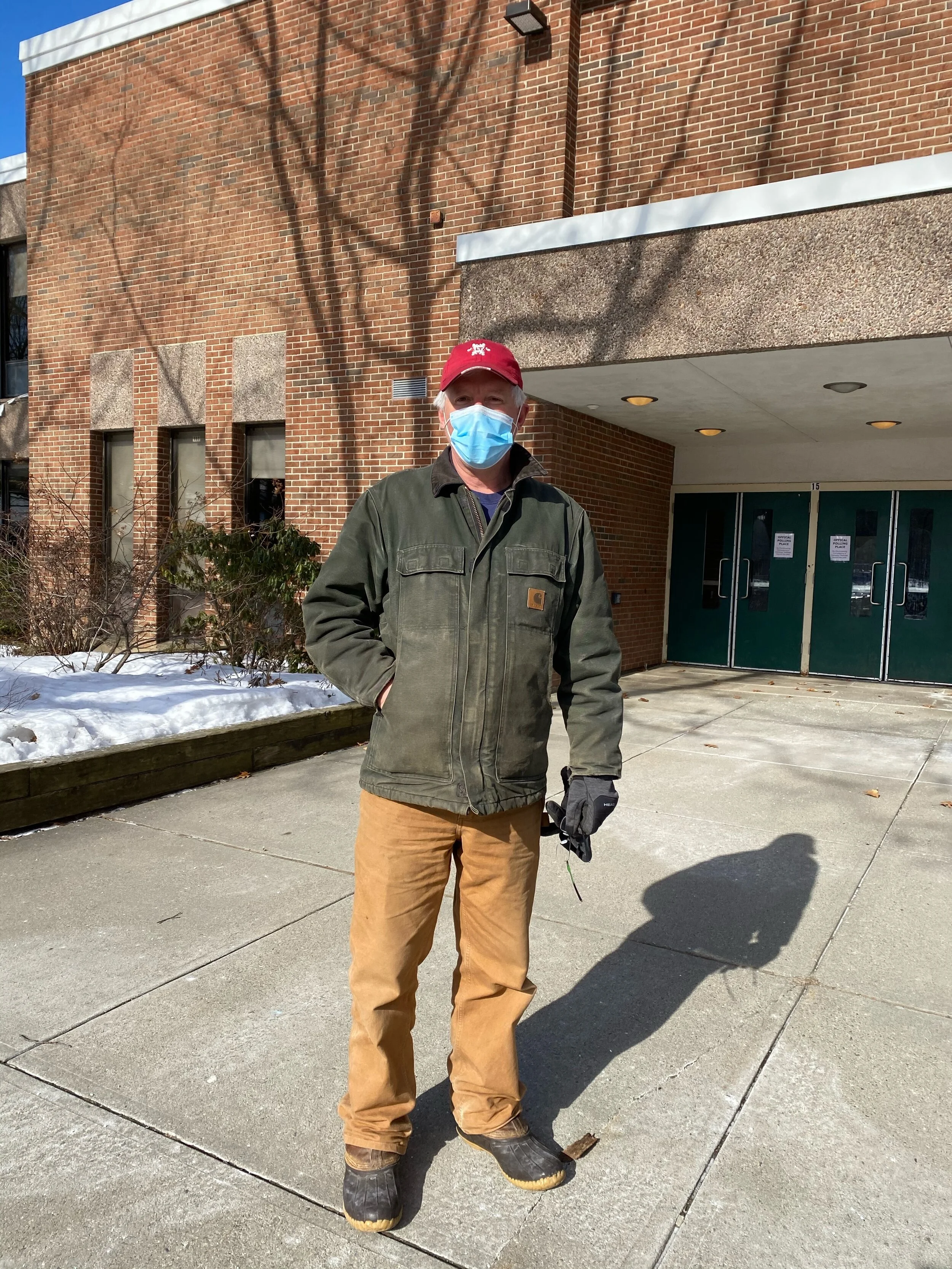Longtime Richmond Town Moderator Clint Buxton outside Camel’s Hump Middle School Tuesday, March 2. (Emily Shedd/Community News Service)