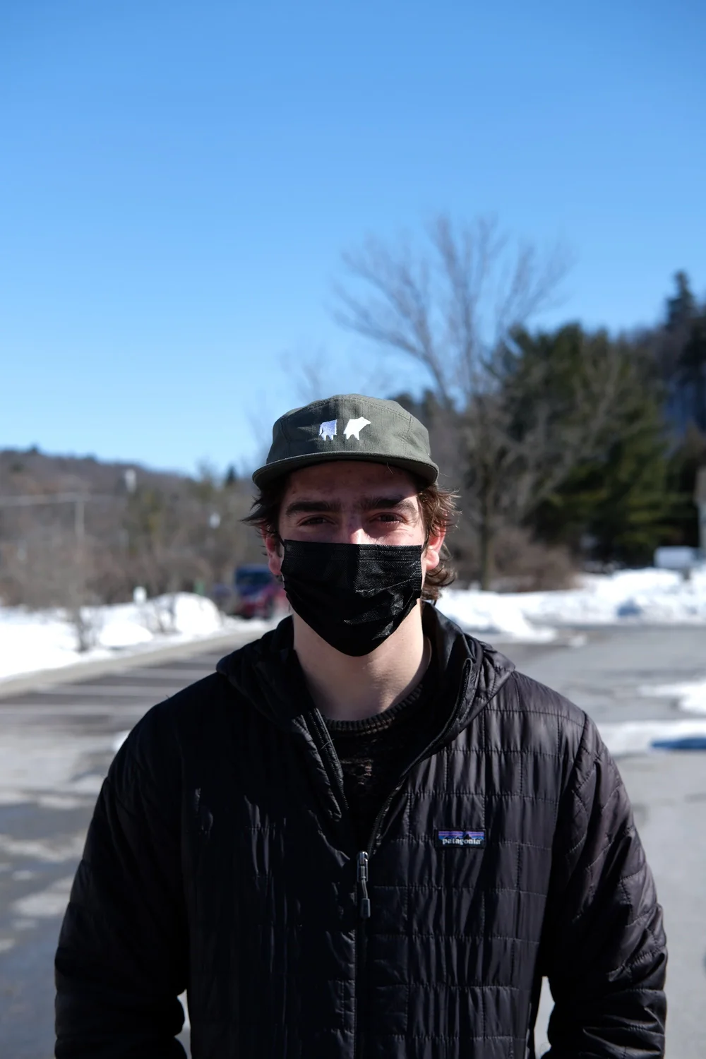 Brett Towle stands for a picture in the parking lot of the Charlotte Town Hall. (Ethan Putnam/Community News Service)