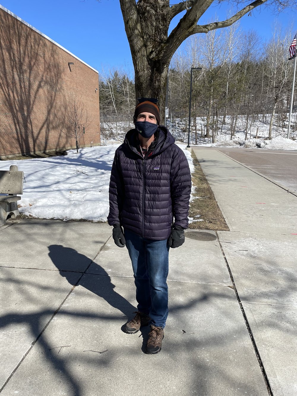 Jim Shallow, 57, stands in front of Camels Hump Middle school in Richmond, VT to cast his votes on Town Meeting Day. (John Ely/Community News Service)