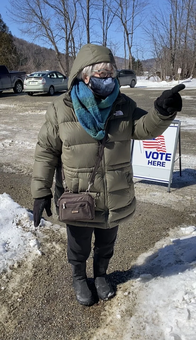 Evergreen Erb, 75, amateur naturalist points to evidence of Sap Sucker holes in a tree on her way into the school to vote. (Kalena Wojtala/Community News Service)