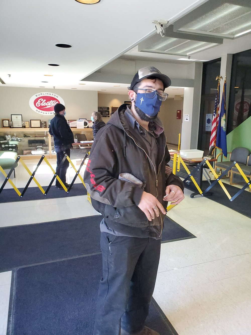 Paul McCarthy, an auto mechanic, heads off into the cold Burlington winter after voting on city issues Tuesday, March 2nd, 2021. (Christopher Meunier/Community News Service)