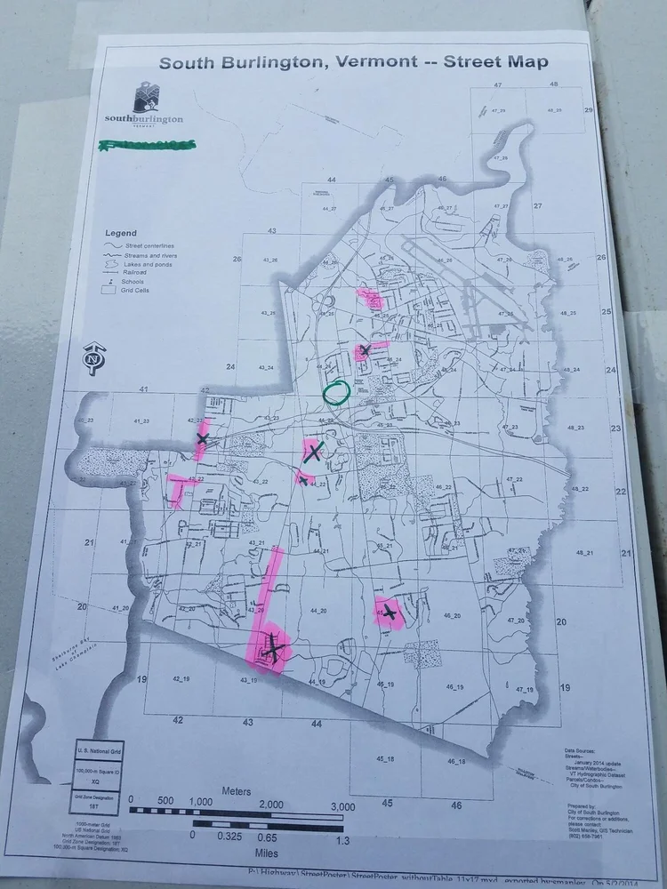 As volunteers returned, where they had cleaned was marked on a map of South Burlington to provide some direction to other volunteers.  (Claire MacQueen/ Community News Service)