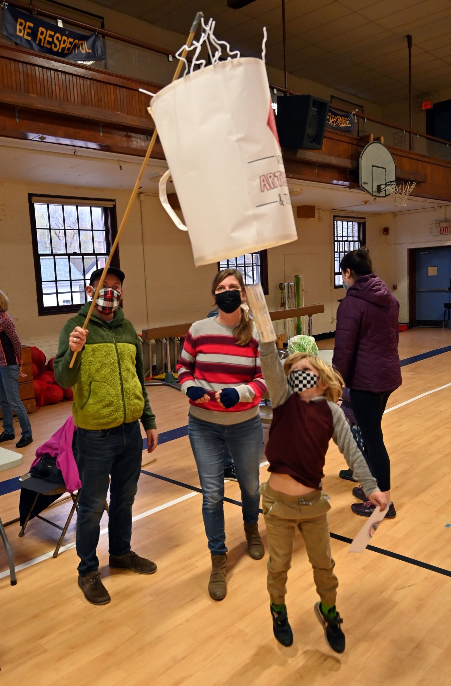  Noah Derman, Erin Hurley, and their son admire their completed lantern. Photo by Gordon Miller  