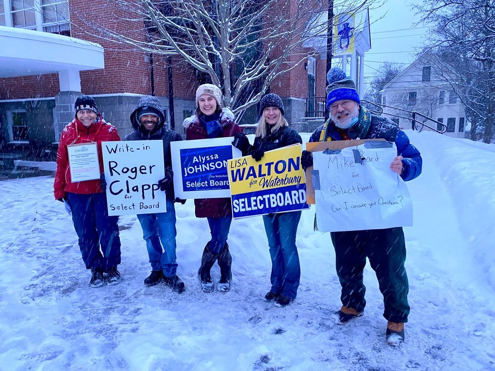   Outside Brookside Primary School on Town Meeting Day. Left to right: Linda Gravell, Waterbury rep to the CVFiber communications union district; Maroni Minter supporting candidate Roger Clapp; candidates for select board Alyssa Johnson, Lisa Walton 