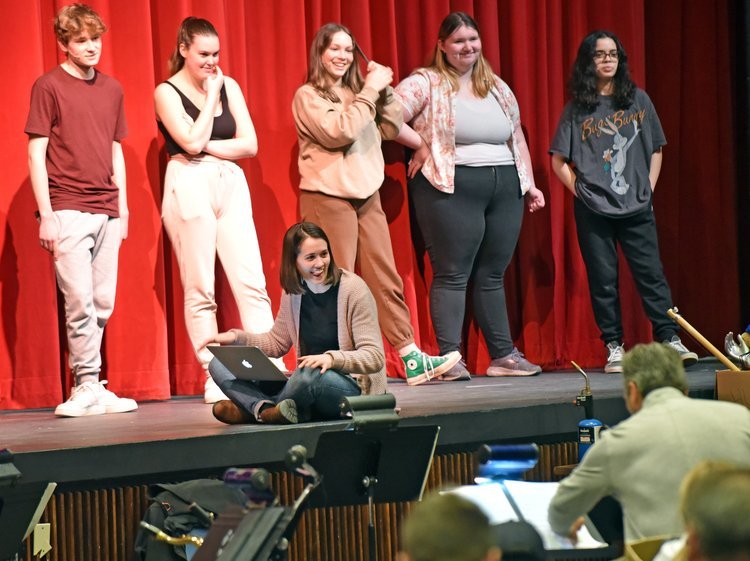   On stage left to right cast standing: Sebastian Ruta, Allie Brooks, Solveig George, Elsie Pawul, Sarah Bevacqui. Music Director Molly Clark seated. Photo by Gordon Miller.   
