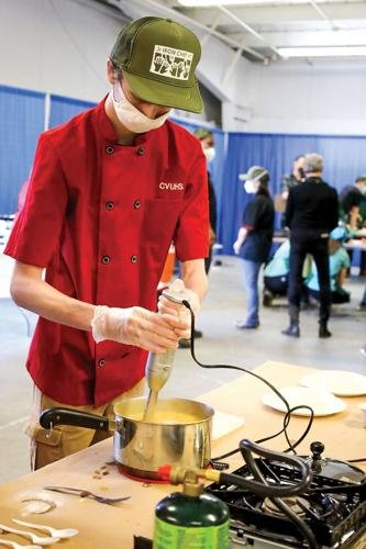   A Champlain Valley Union contestant whisks soup as the end of the competition draws near.  