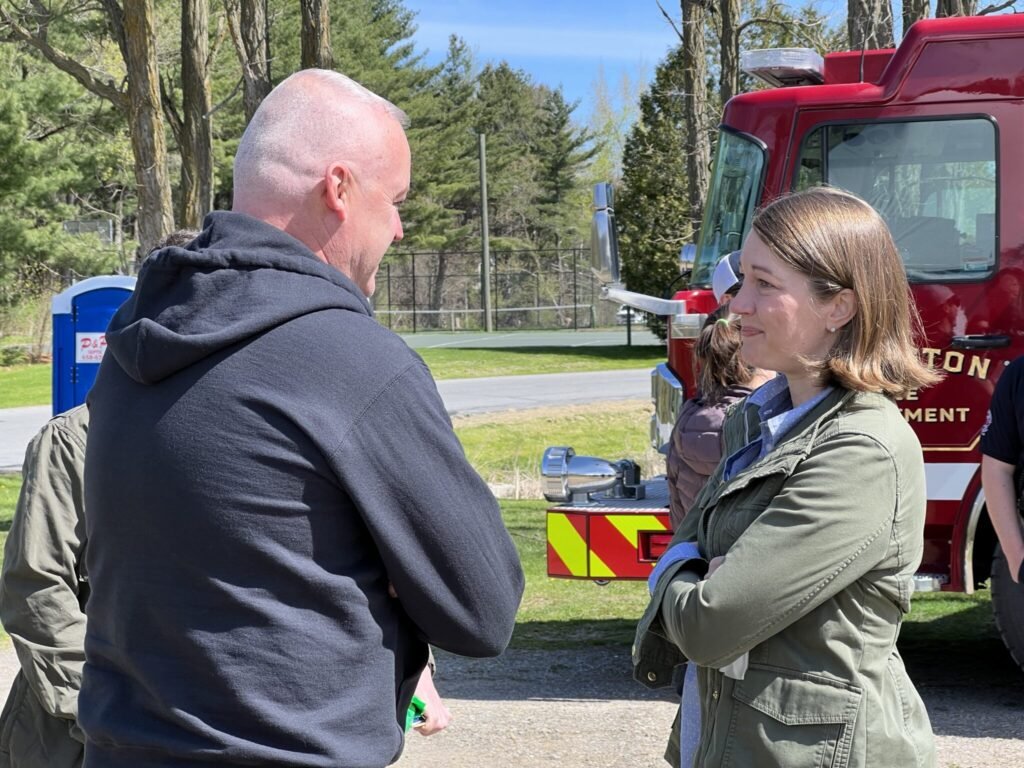  Lt. Governor and U.S. congressional candidate Molly Gray talks with Kevin Mazuzan of the Vermont chapter of the Red Cross. 