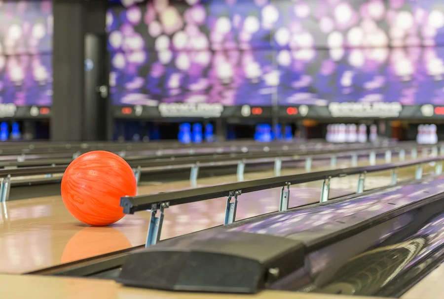 bigstock-bowling-ball-rolls-in-between--230357449.jpg