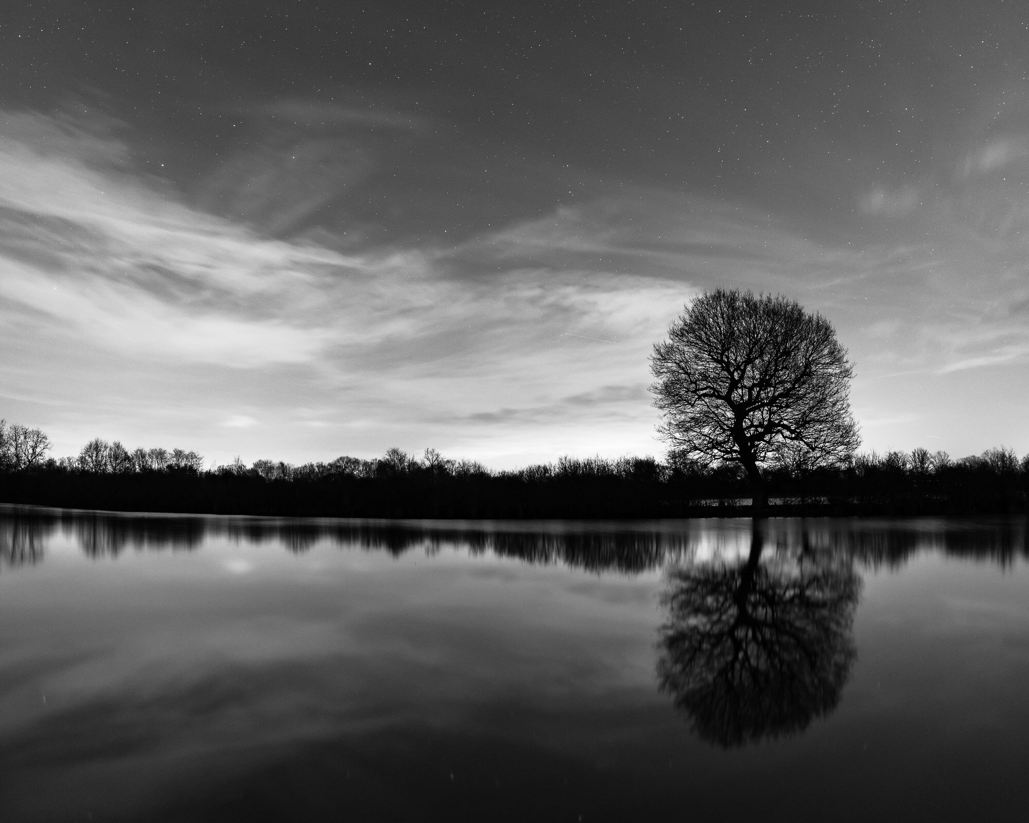 One evening spent in water perilously close to the tops of my wellies standing as still as possible. It isn’t very often that I’ll take a black and white photo but this seemed to lend itself perfectly to the style what with all of the light polluti