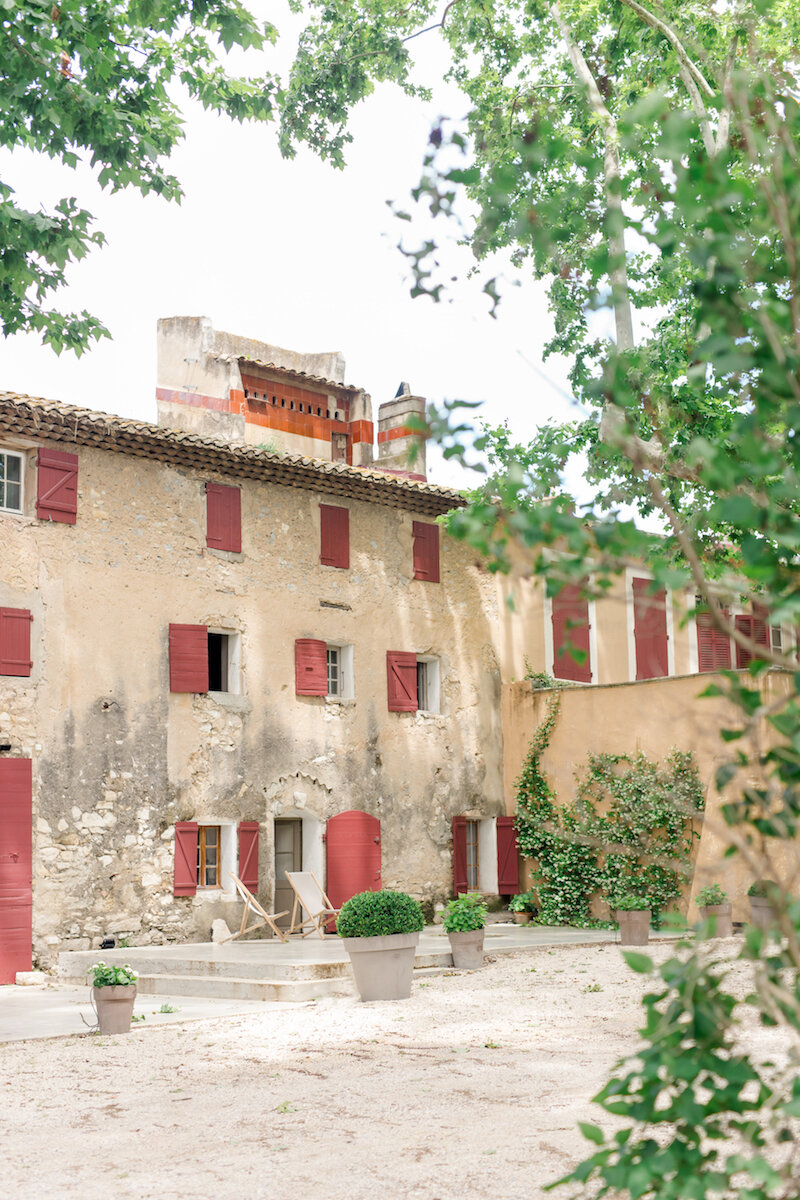 Wedding venue in Provence, here is Le Moulin de la Recense, close up on the main entrance with it's red color windows.