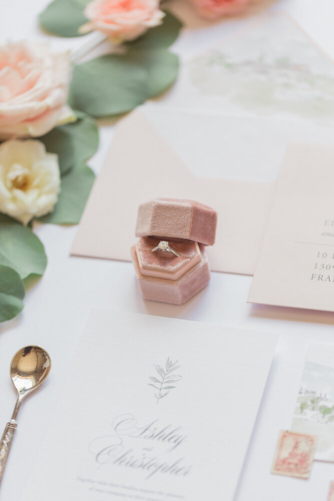Details and close up on the bride's ring in a small pink velvet box.