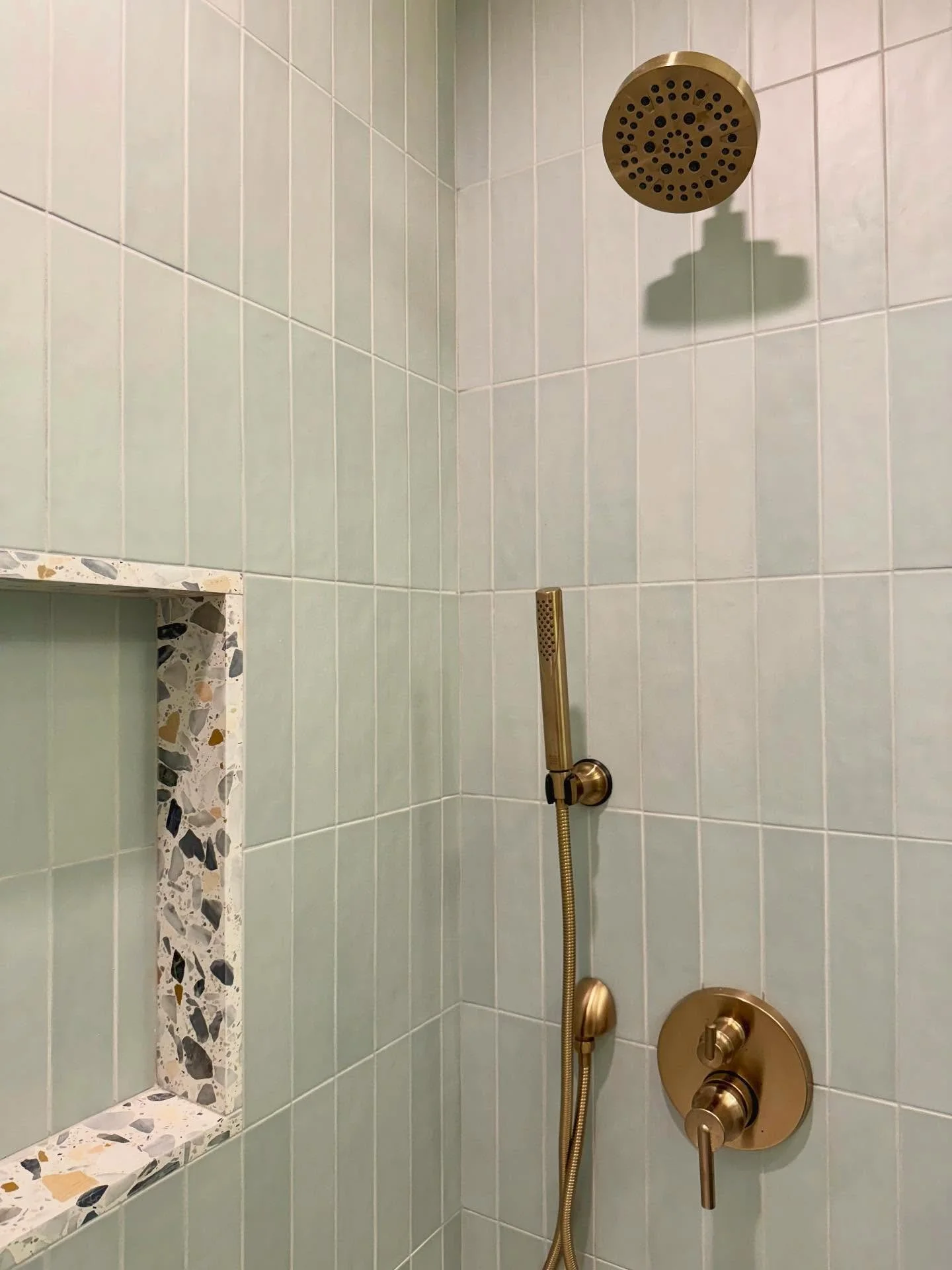 Brushed brass fixtures 🤝🏼 mint green tile.
.
Kids bath @ Longridge renovation.