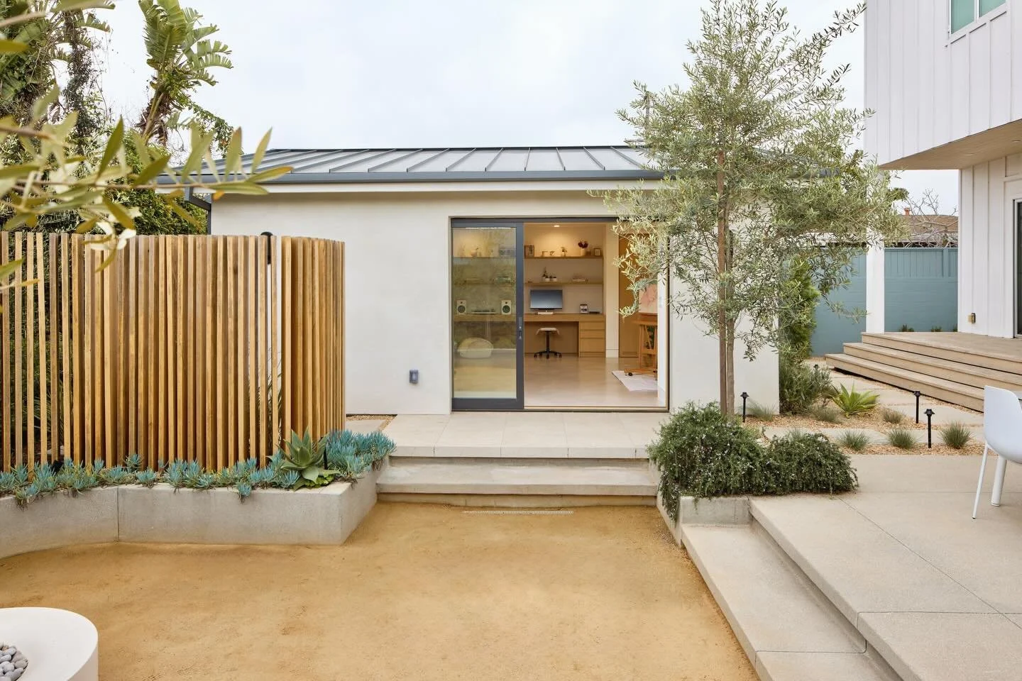 Creative studio conversion in the city of Westchester. 

Exterior spaces should be designed alongside the building envelope to create smooth indoor-outdoor transitions, improve drainage, and maintain a cohesive aesthetic.

Images: @shelbybournephoto 