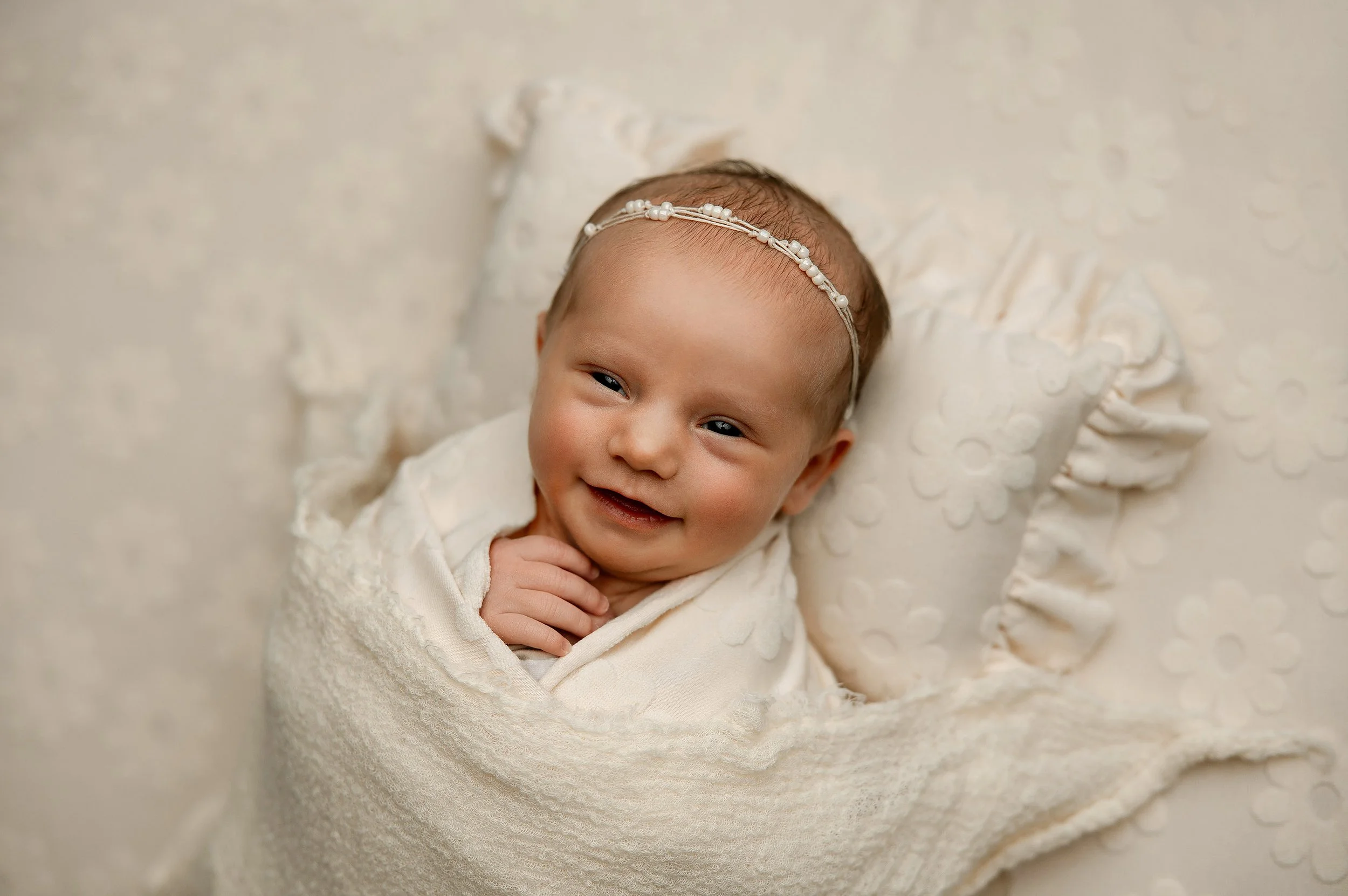 awake newborn baby with bright eyes during a studio newborn photography session in Metro Detroit